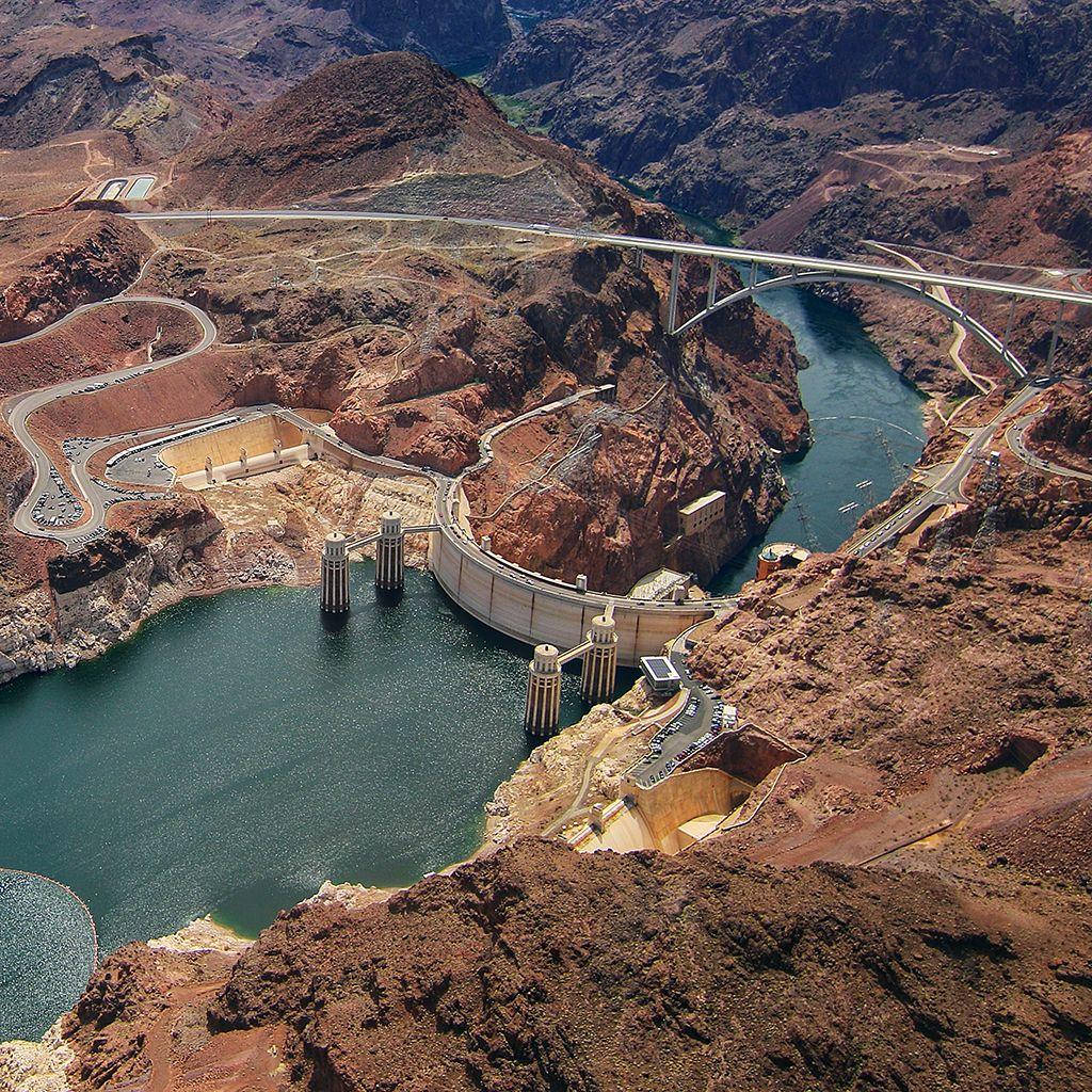 Majestic Hoover Dam Nestled In A Rocky Landscape Wallpaper