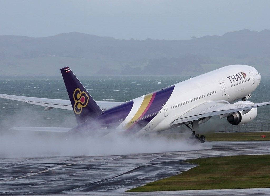 Majestic Thai Airways Plane On Runway Wallpaper