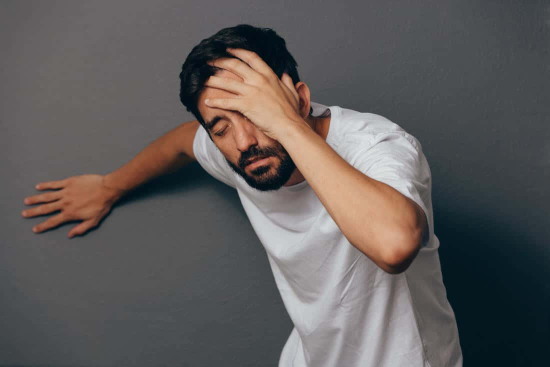 Man Experiencing Dizziness Before Fainting.jpg Wallpaper