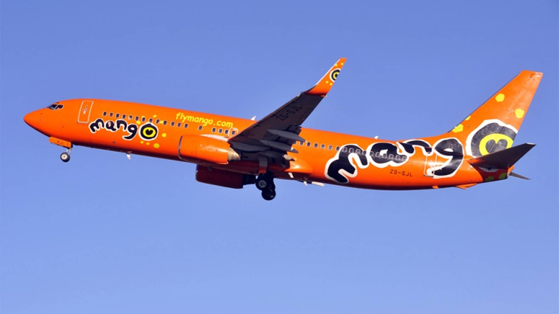 Mango Airlines Plane On Blue Sky Wallpaper