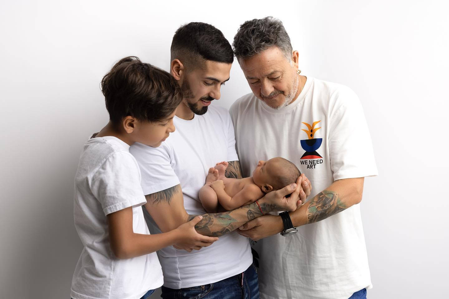 Manuel Lanzini Cradling A Baby Wallpaper