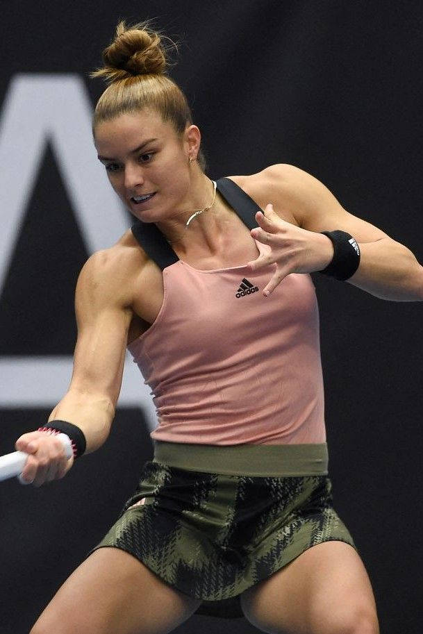 Maria Sakkari In Action - Reaching For A Forehand Wallpaper