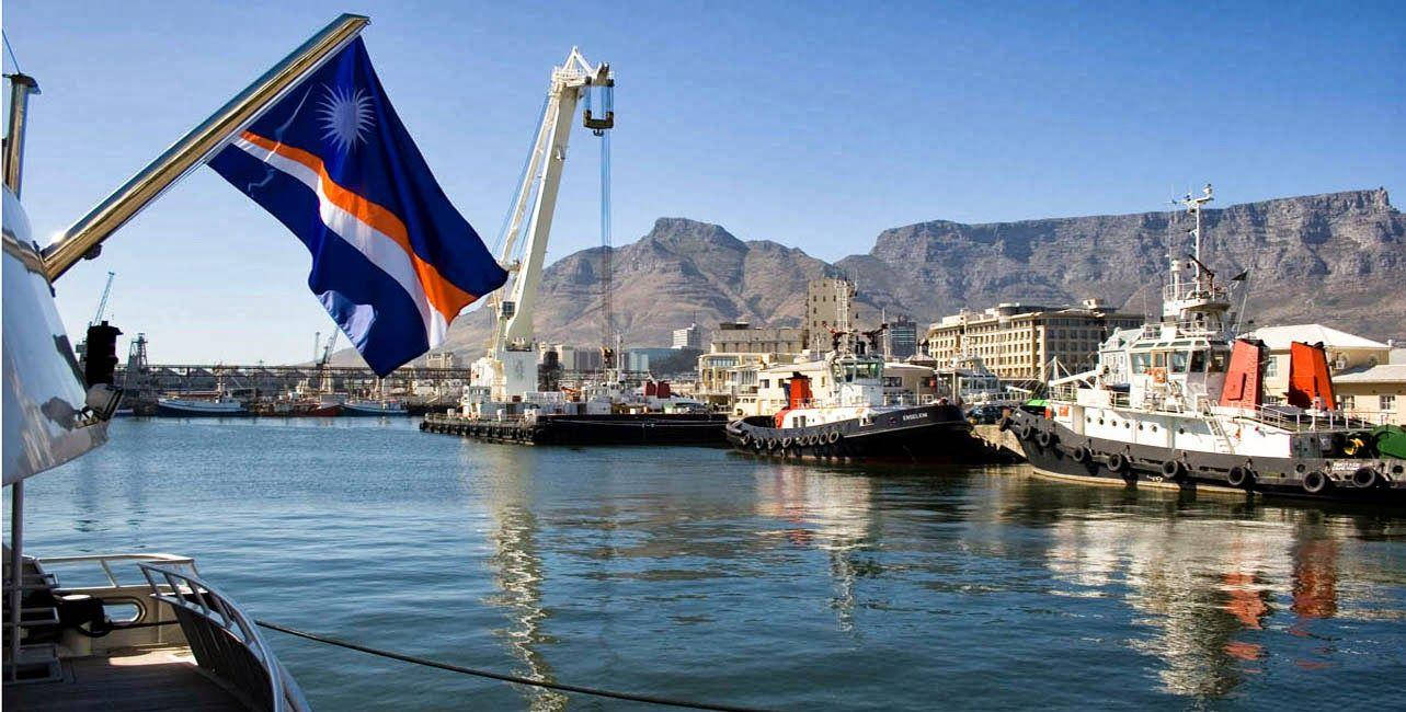 Marshall Islands Flag Fluttering At The Pier Wallpaper