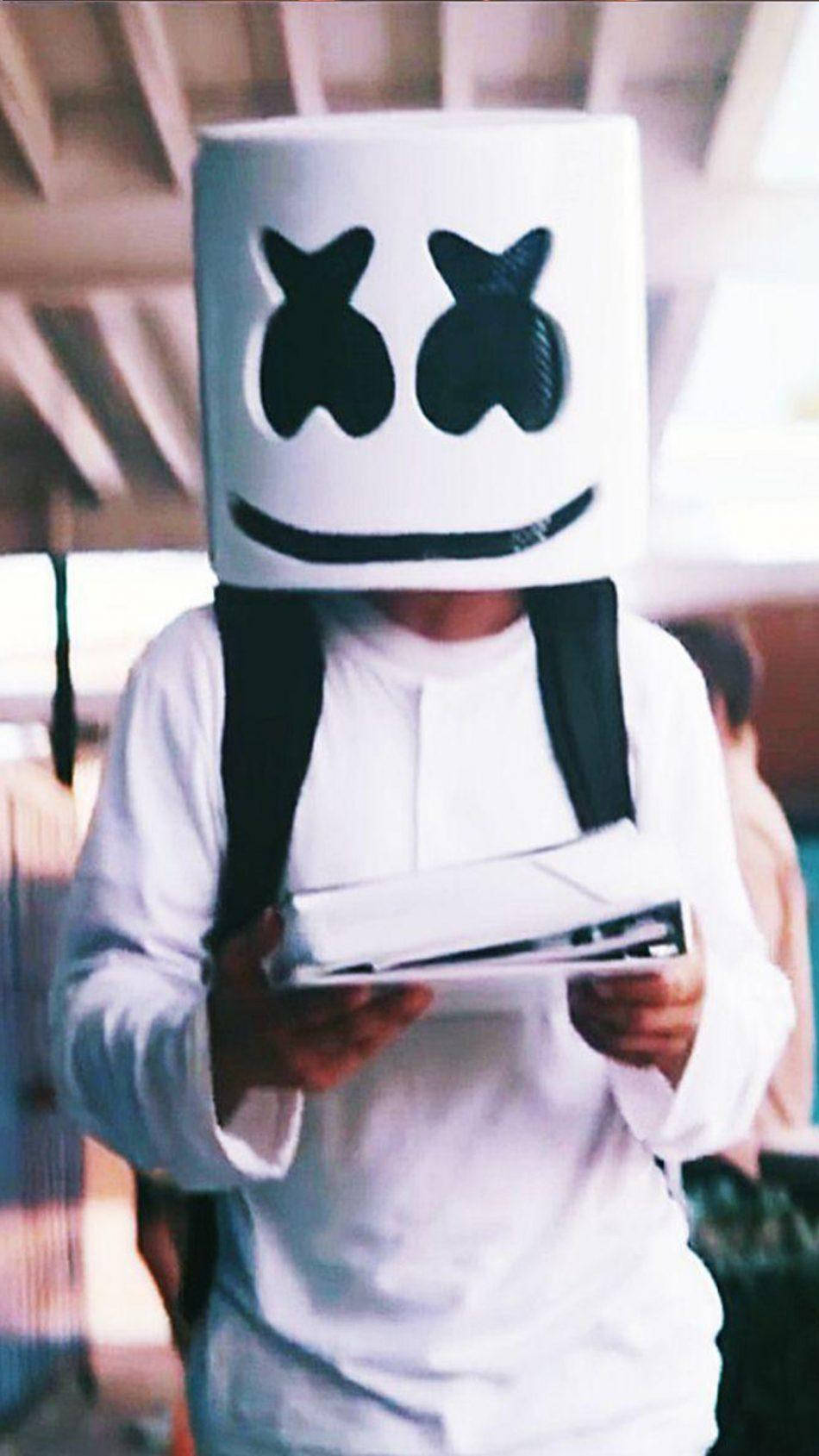 Marshmello Iphone Holding Books Wallpaper