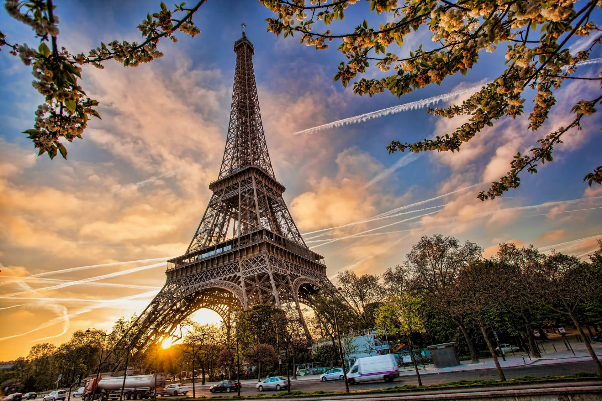 Marvel At The Beauty Of Paris During Sunrise At The Eiffel Tower Wallpaper