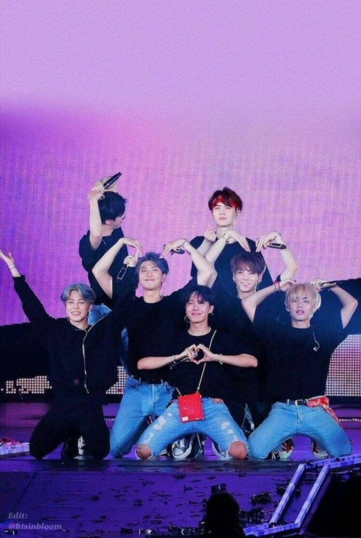 Members Doing Heart Poses In Their Bts Concert Wallpaper