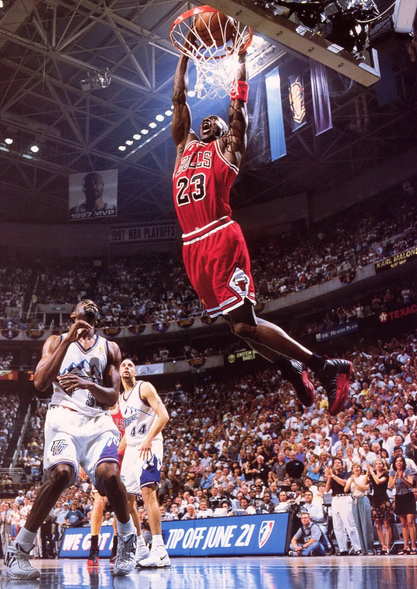 Michael Jordan Flies Through The Air Making A Legendary Dunk Wallpaper