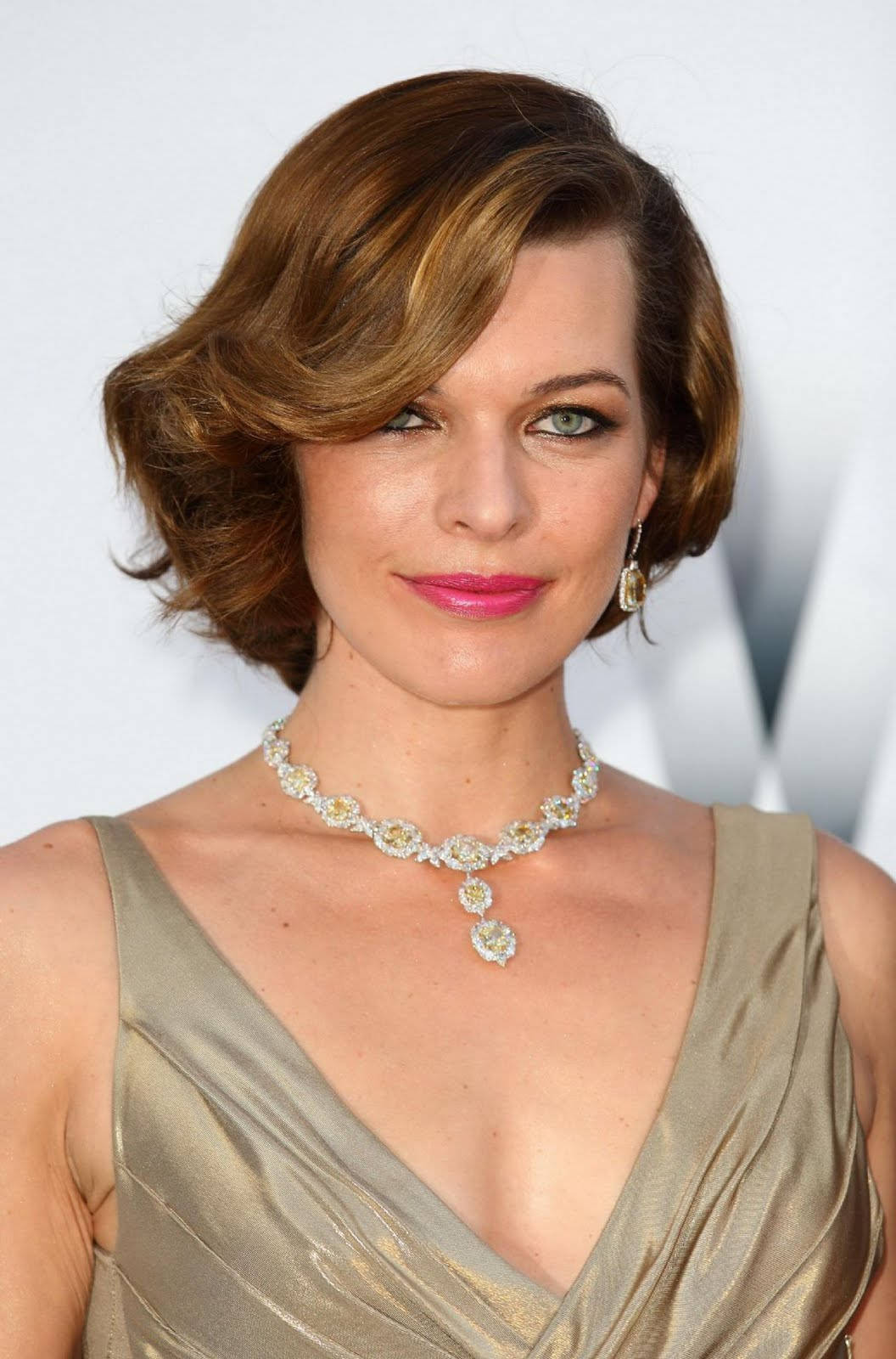 Milla Jovovich Alluring Gown Red Carpet Wallpaper