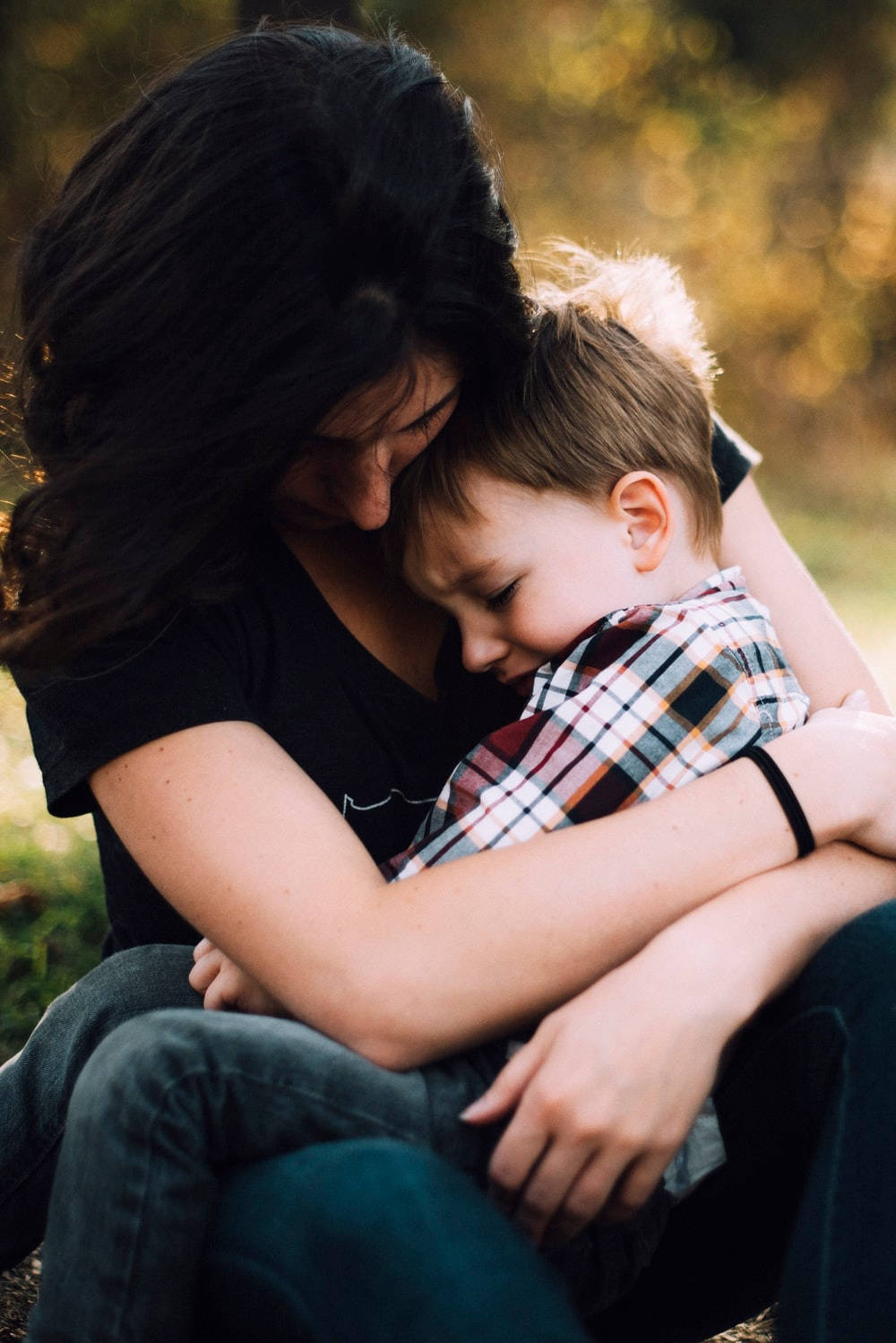 Mom And Son Sitting On Lap Wallpaper