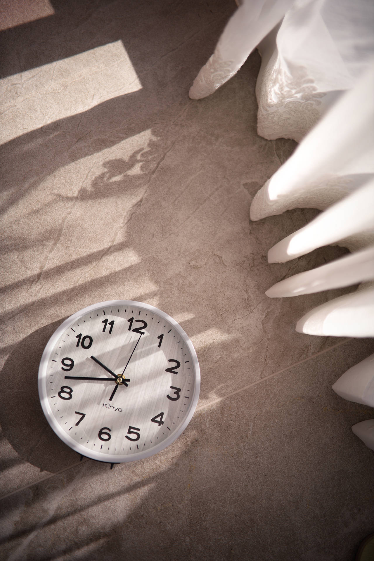 Monochrome Elegance - An Analog Clock On The Floor Wallpaper