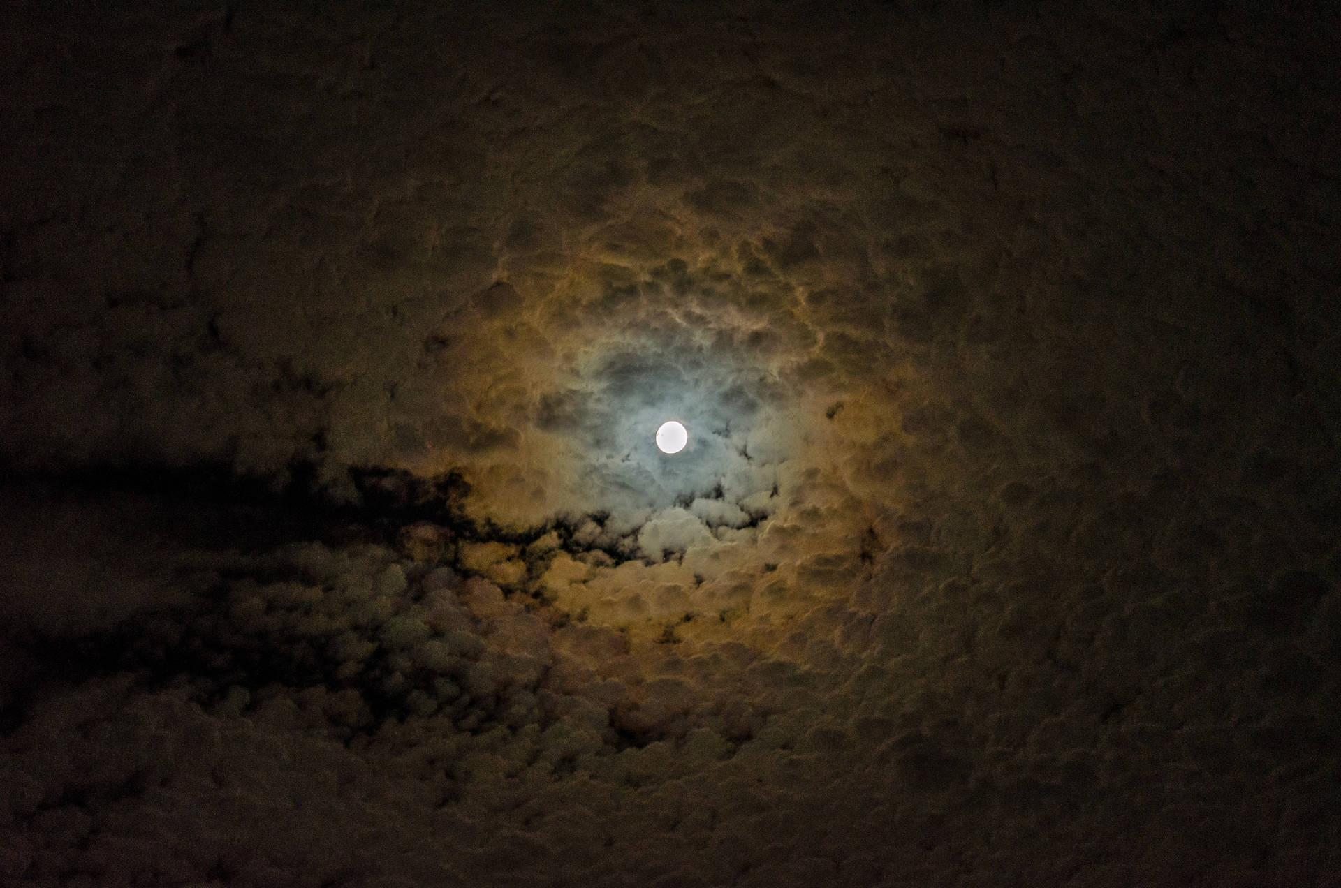 Moonlit Clouds Illuminated Against The Night Sky Wallpaper
