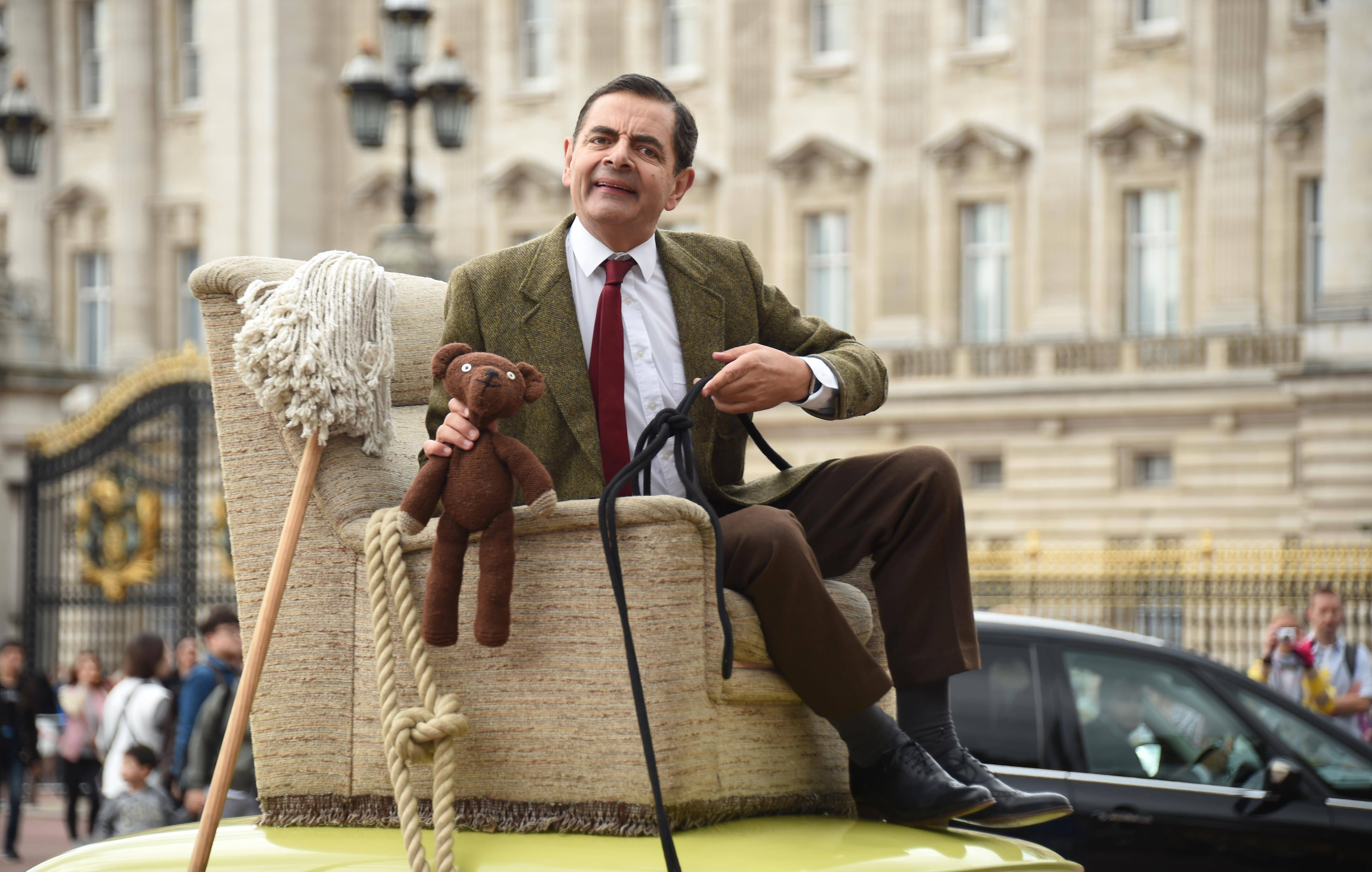 Mr Bean 4k Top Of Car Wallpaper