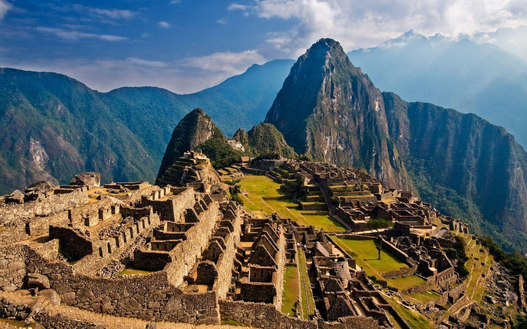 Mystical Sunrise Over The Iconic Machu Picchu, Peru Wallpaper