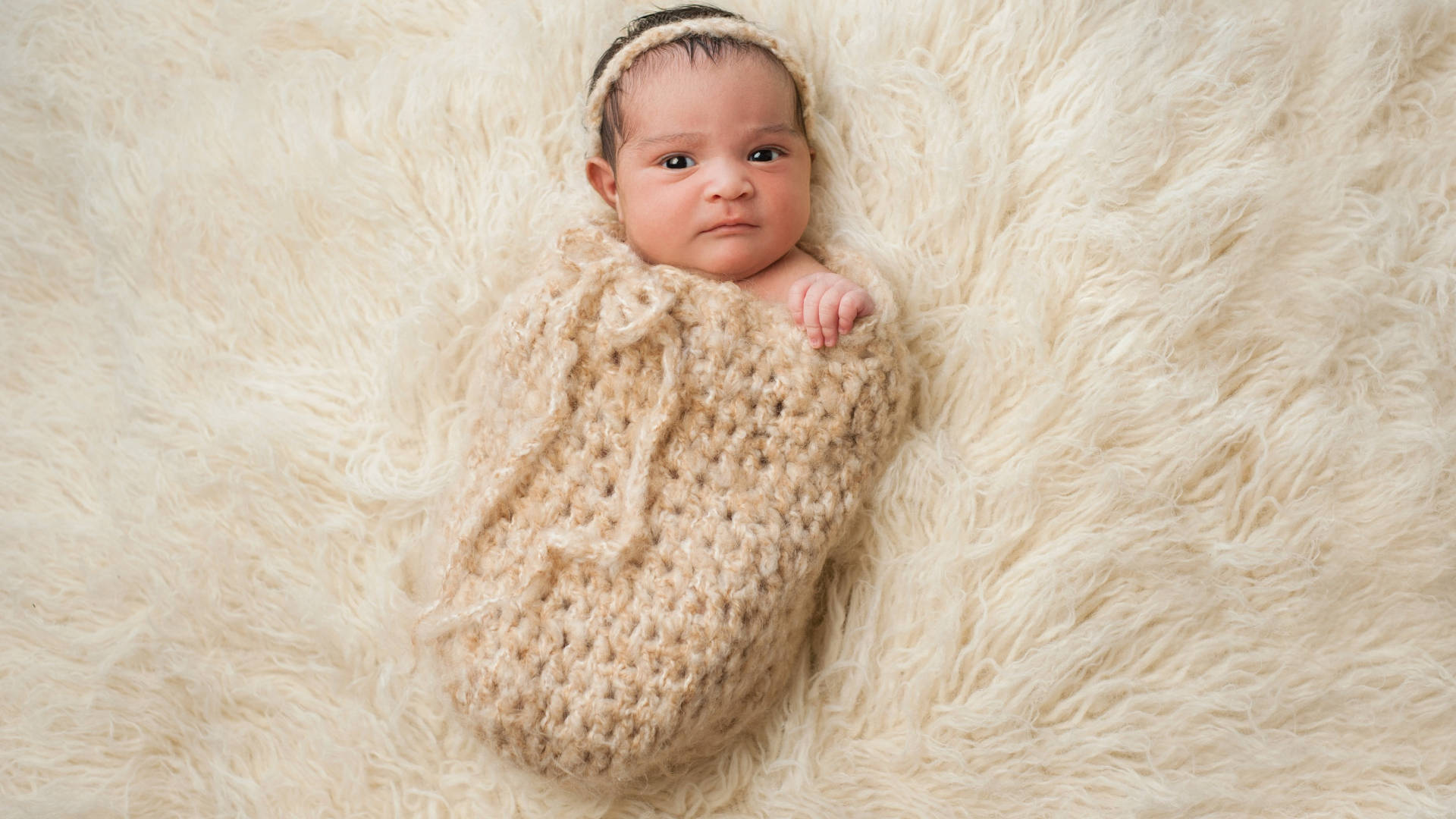 Newborn Baby Love On Faux Fur Wallpaper