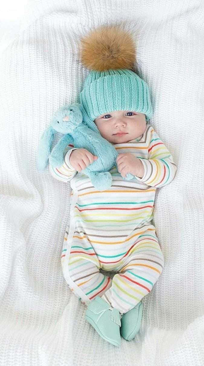 Newborn_ Baby_with_ Blue_ Hat_and_ Toy Wallpaper