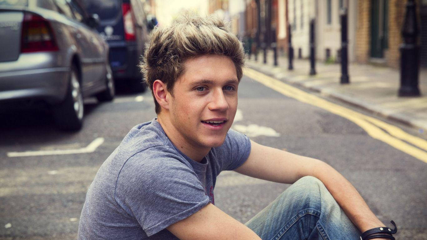 Niall Horan Sitting Road Wallpaper