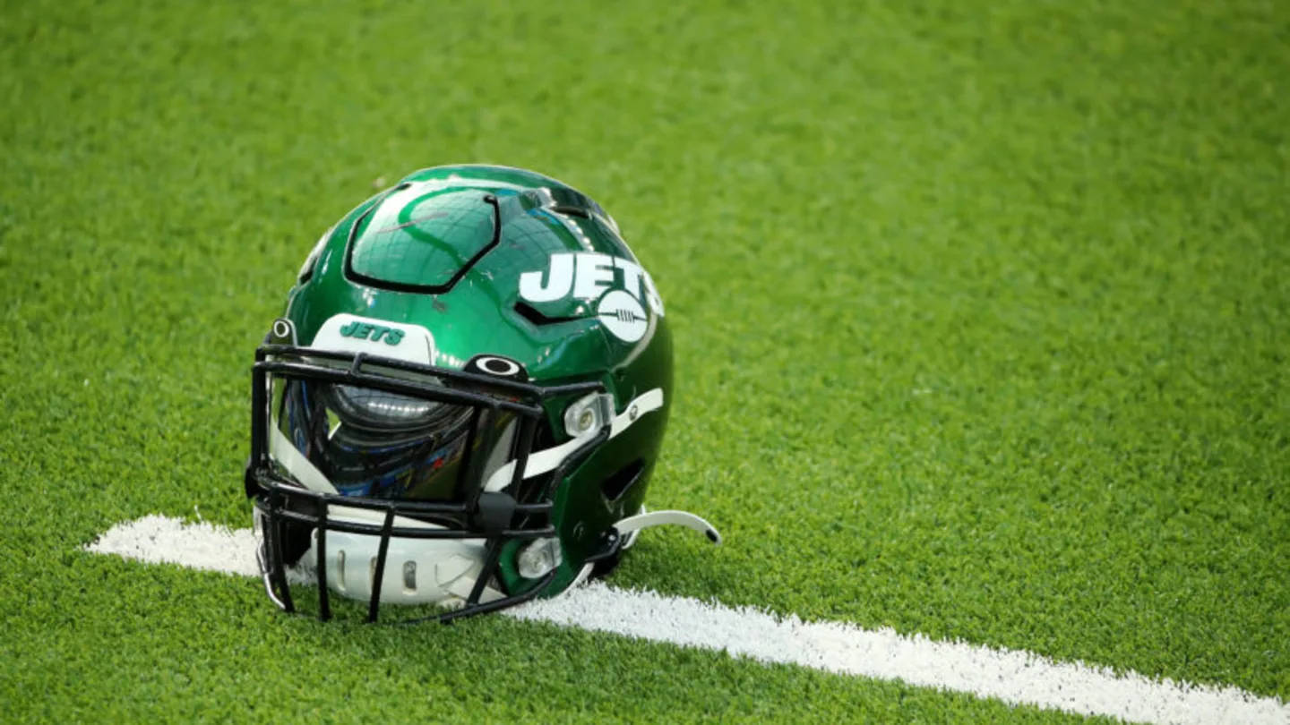 Ny Jets Helmet On The Field Wallpaper