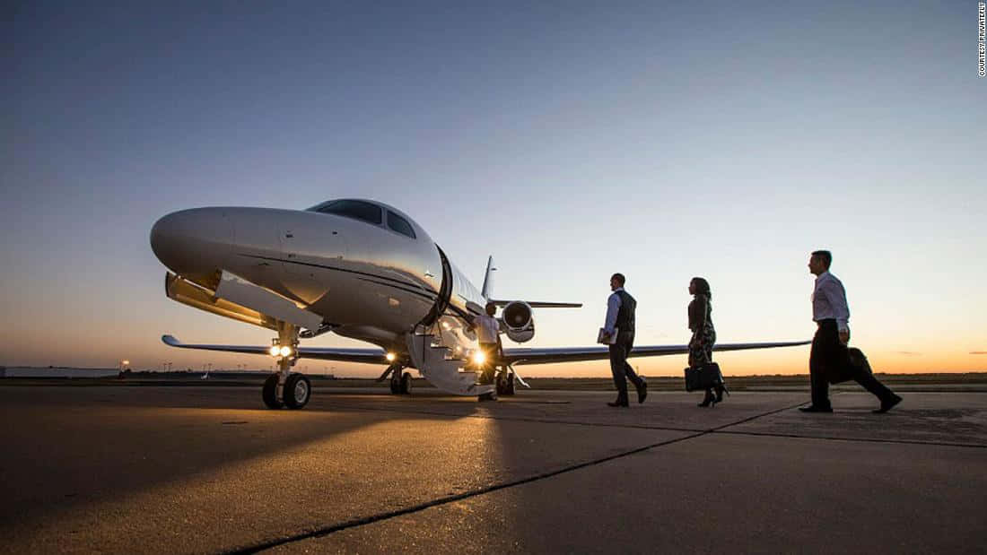 Officials Boarding A Luxurious Private Jet Wallpaper