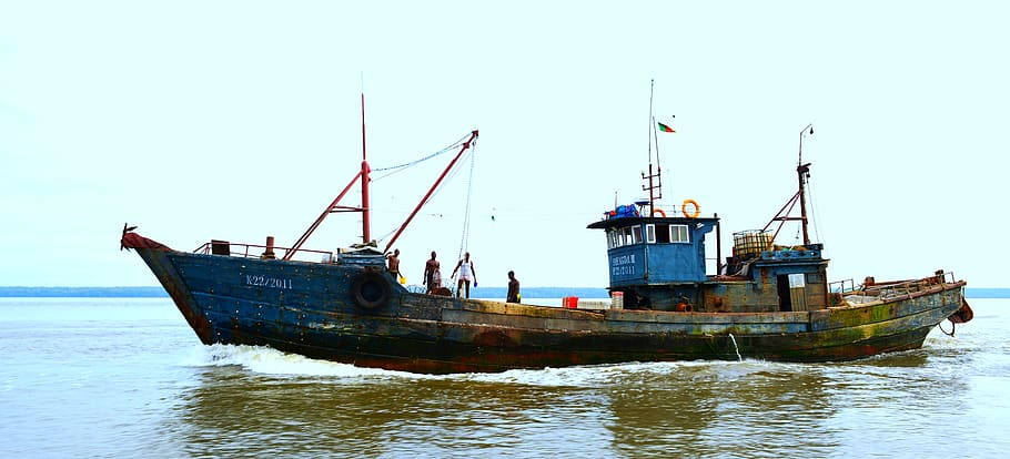 Old Boat Sailing In Wouri River Cameroon Wallpaper