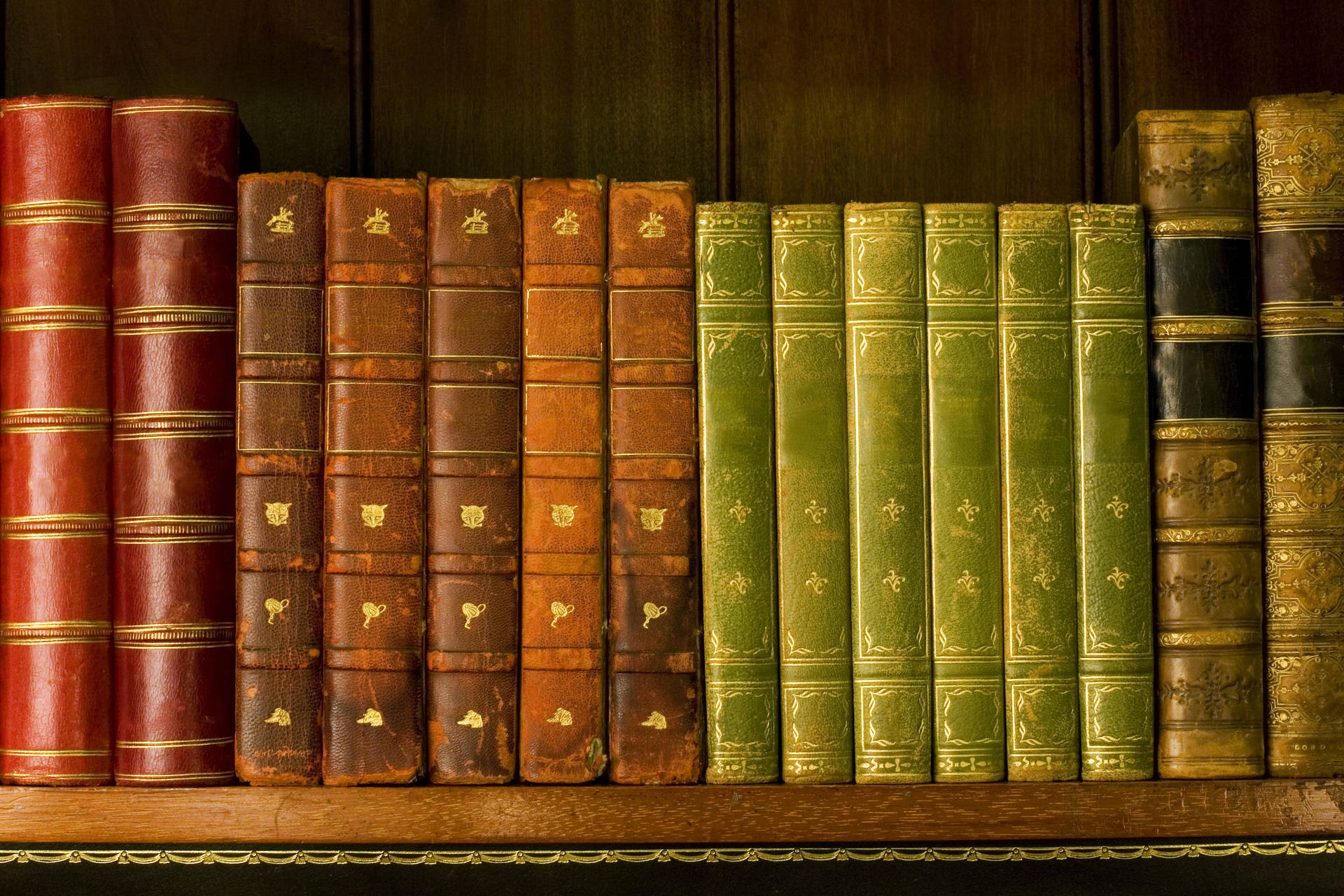 Old Books On A Library Shelf Wallpaper