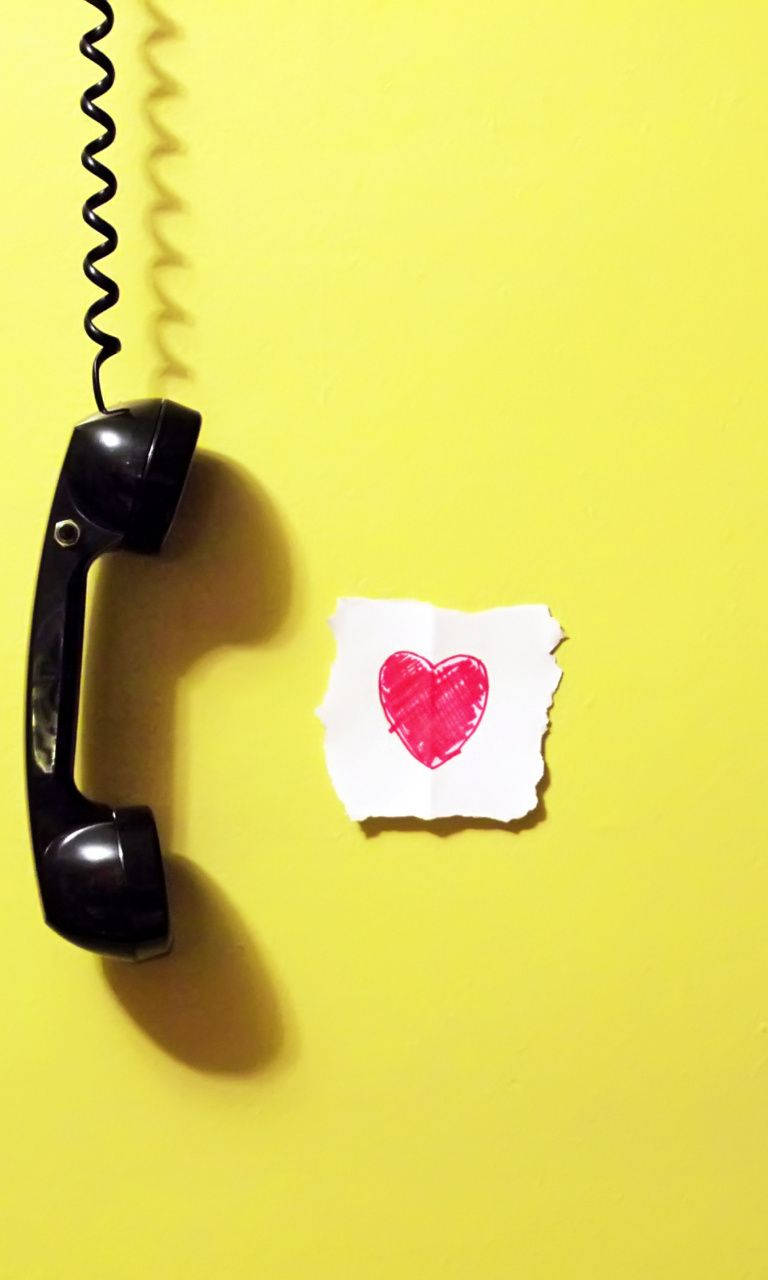 Old Telephone In Cute Yellow Background Wallpaper