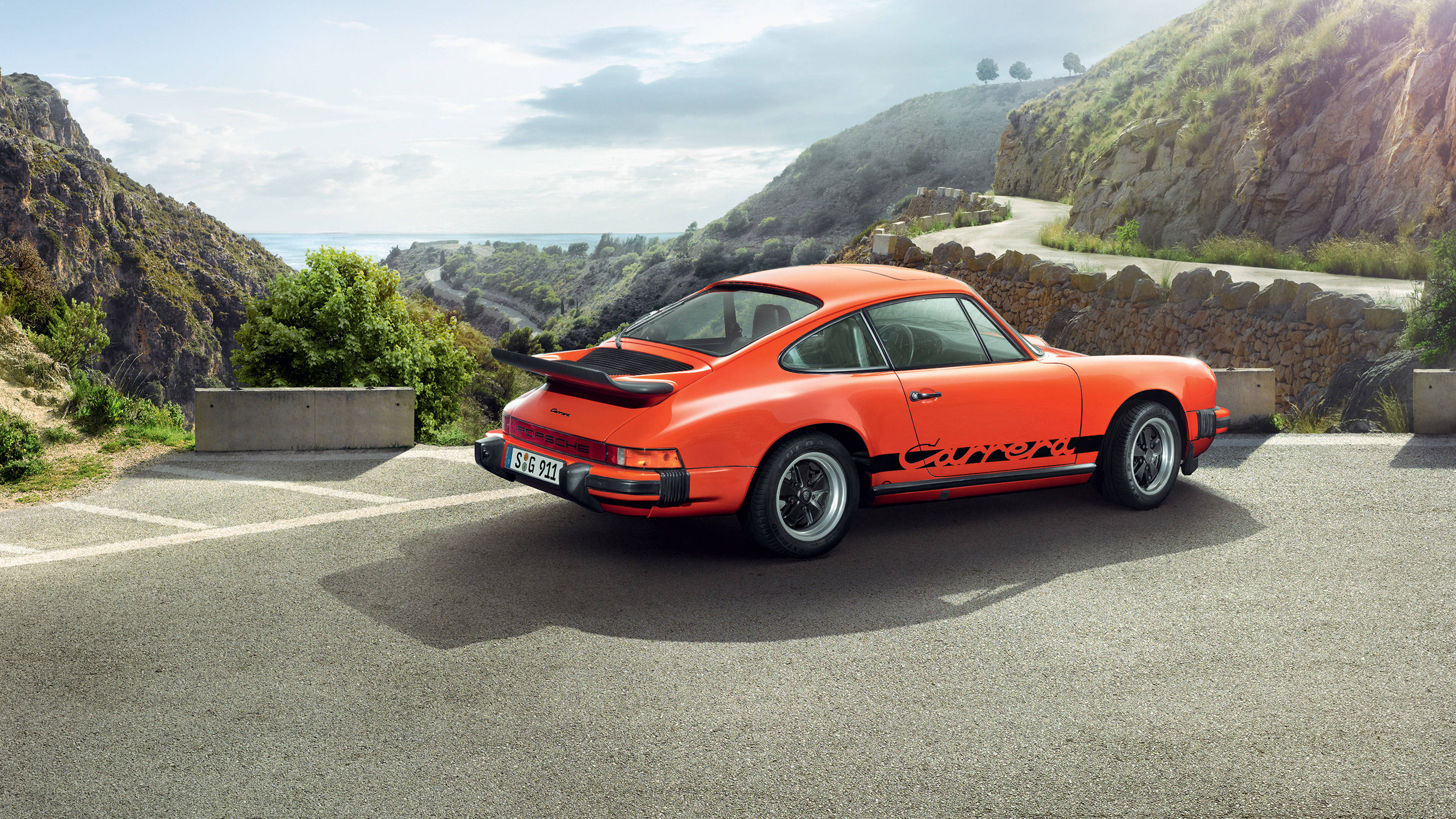 Orange Porsche 911 On Mountain Road Wallpaper