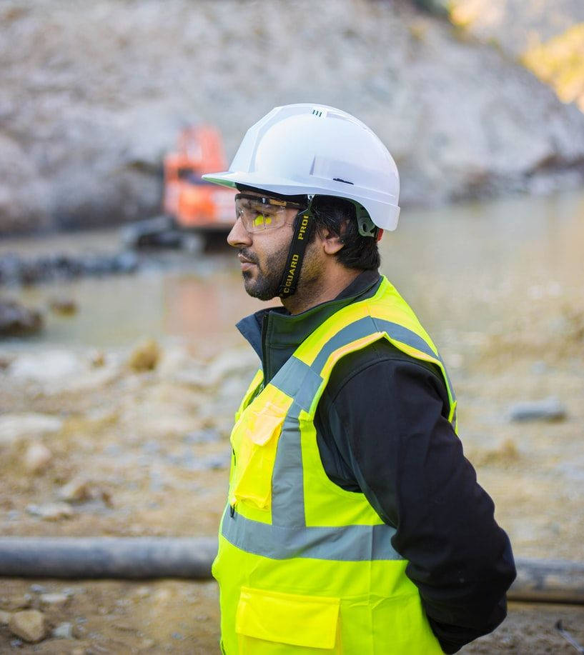 Passionate Engineer At Work In A Construction Site Wallpaper