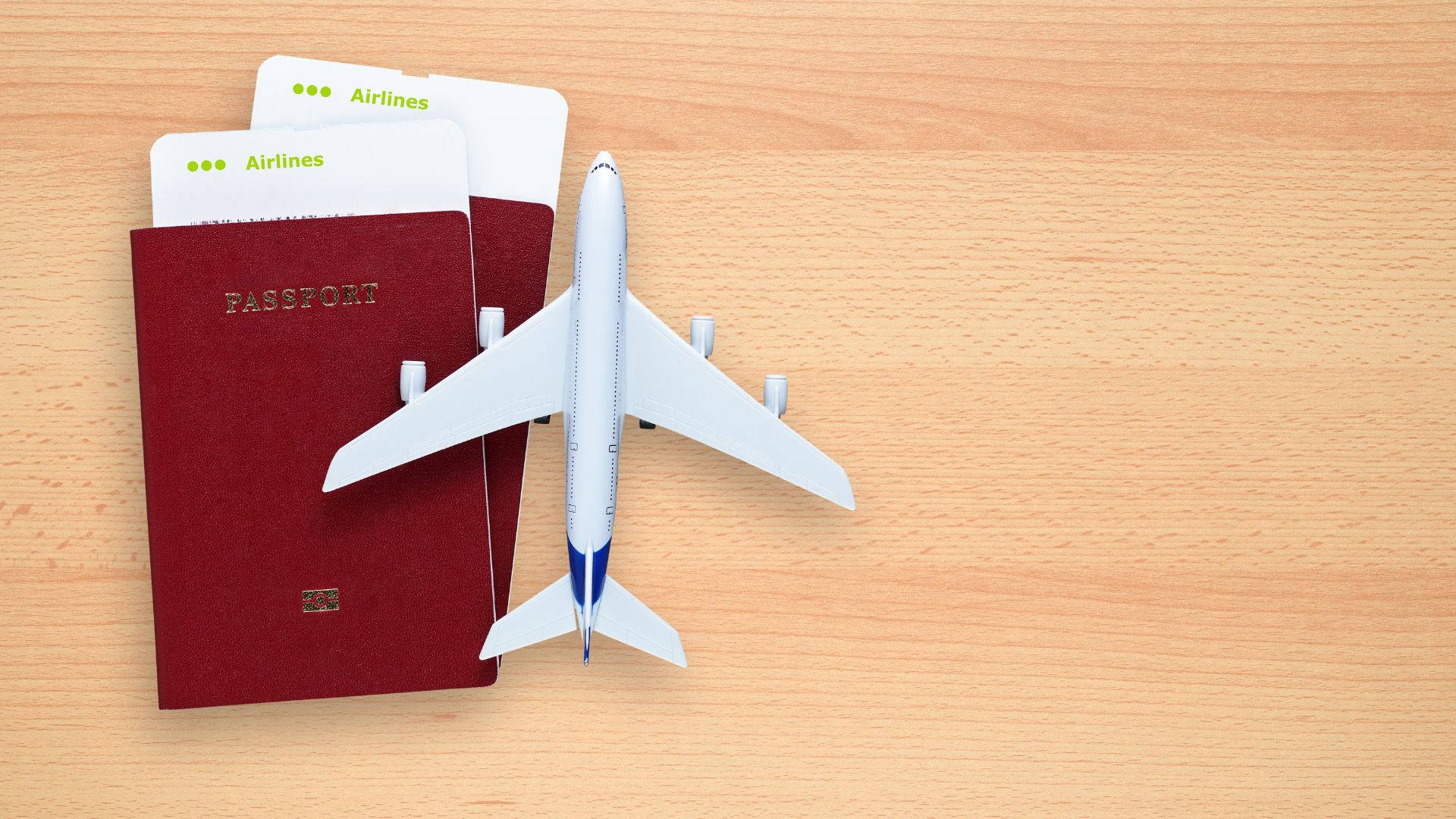 Passport And Toy Airplane On Table Wallpaper