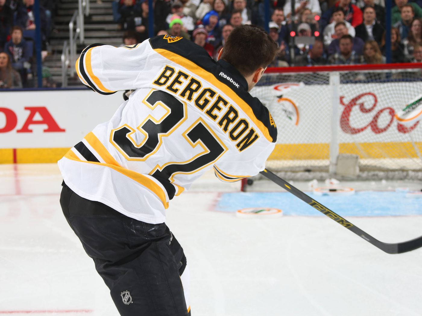 Patrice Bergeron In Action During A Hockey Game Wallpaper