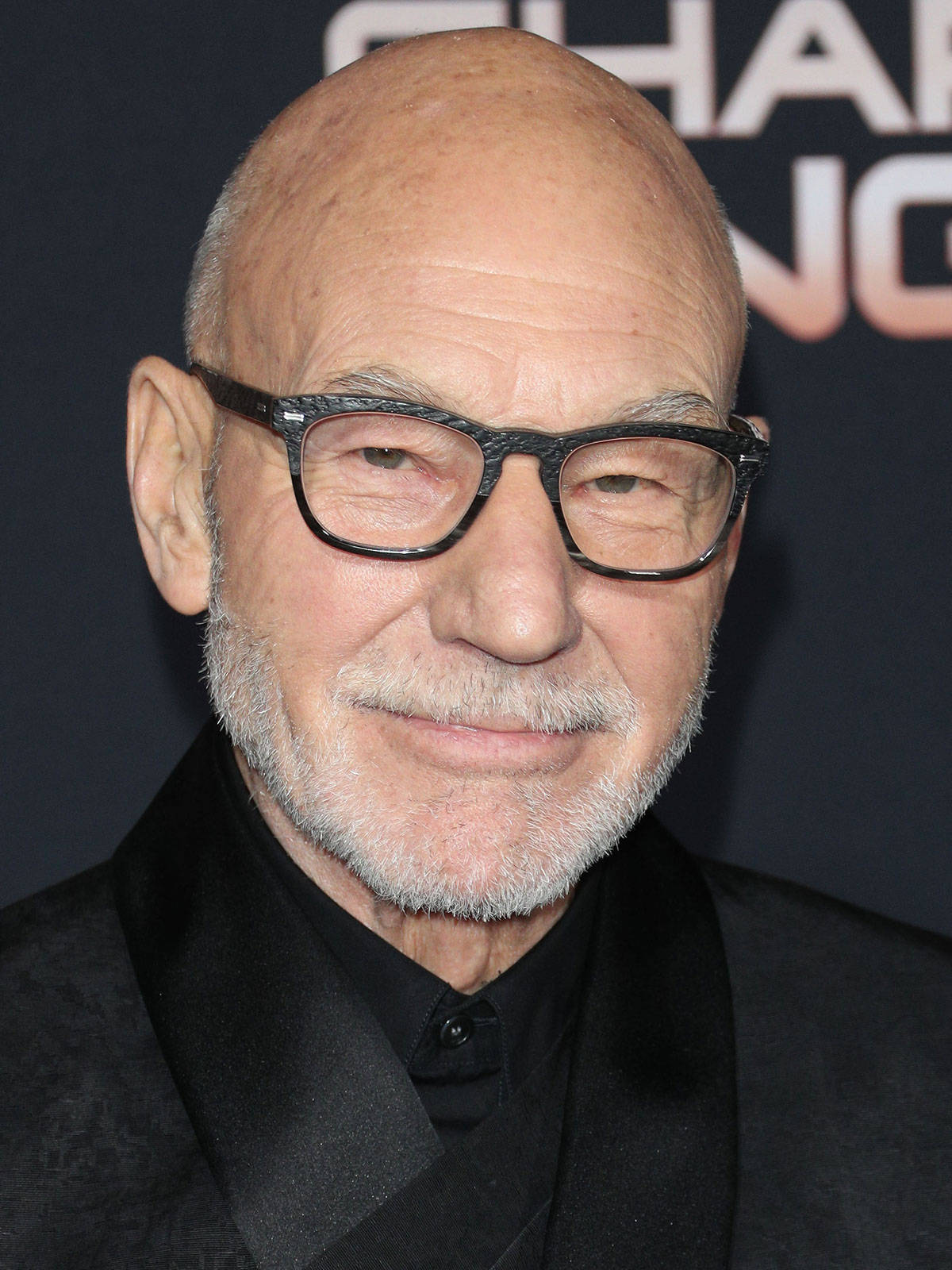 Patrick Stewart In Transparent Black Eyeglasses Wallpaper