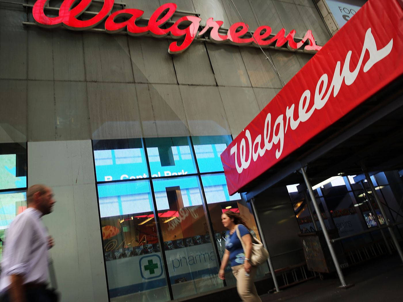 People Passing Walgreens Store Wallpaper