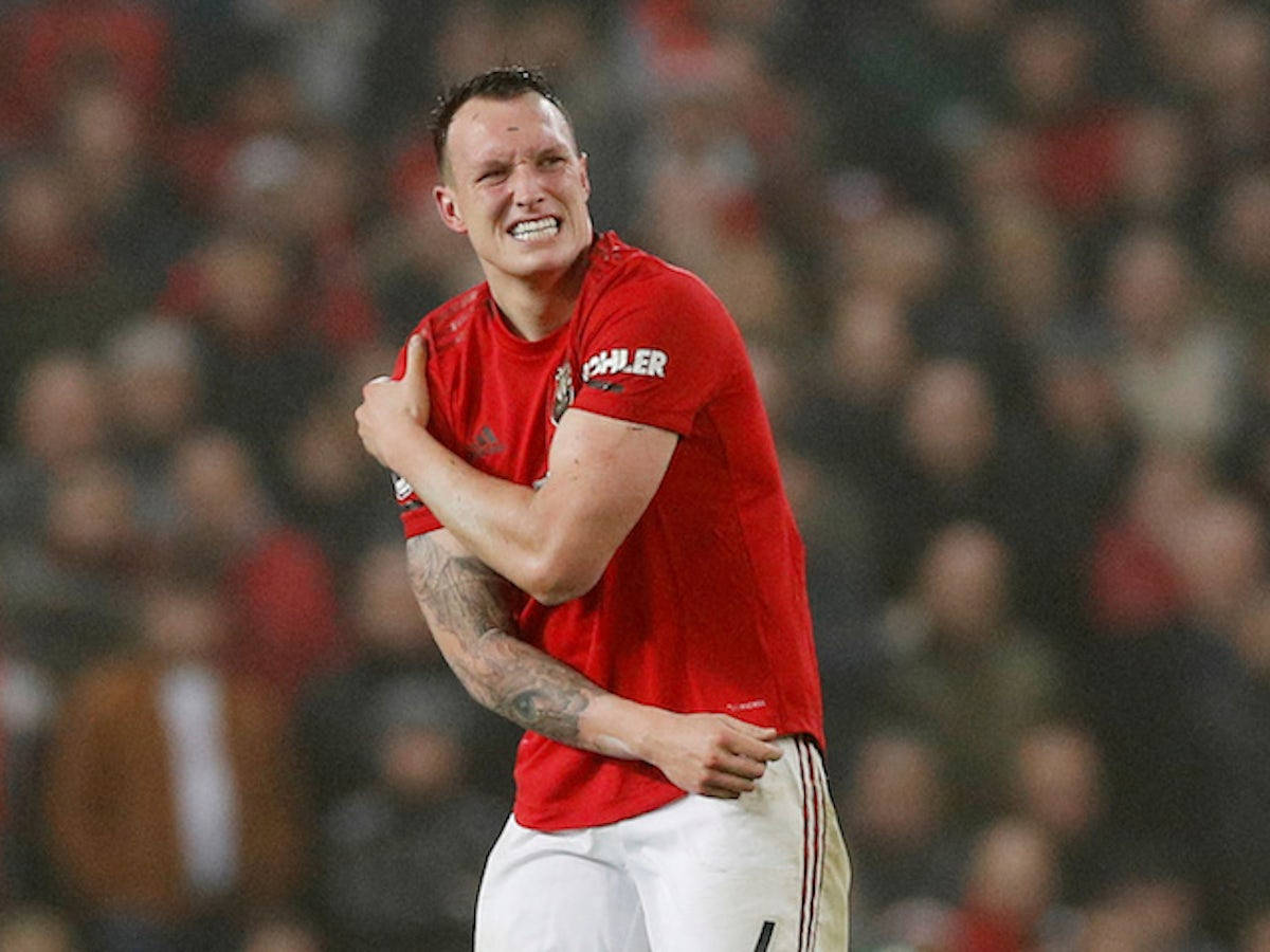 Phil Jones Holding Right Arm Wallpaper