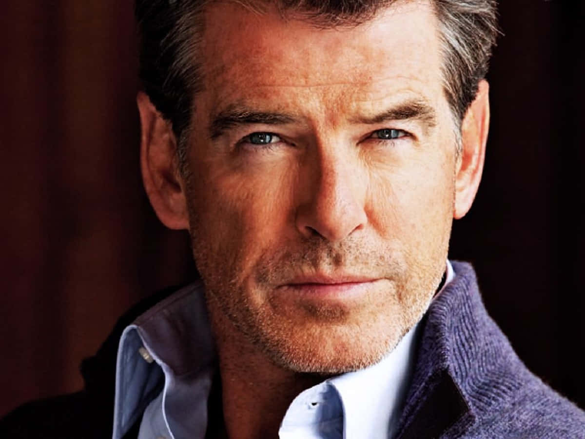 Pierce Brosnan Looking Dapper In A Classic Tuxedo Wallpaper