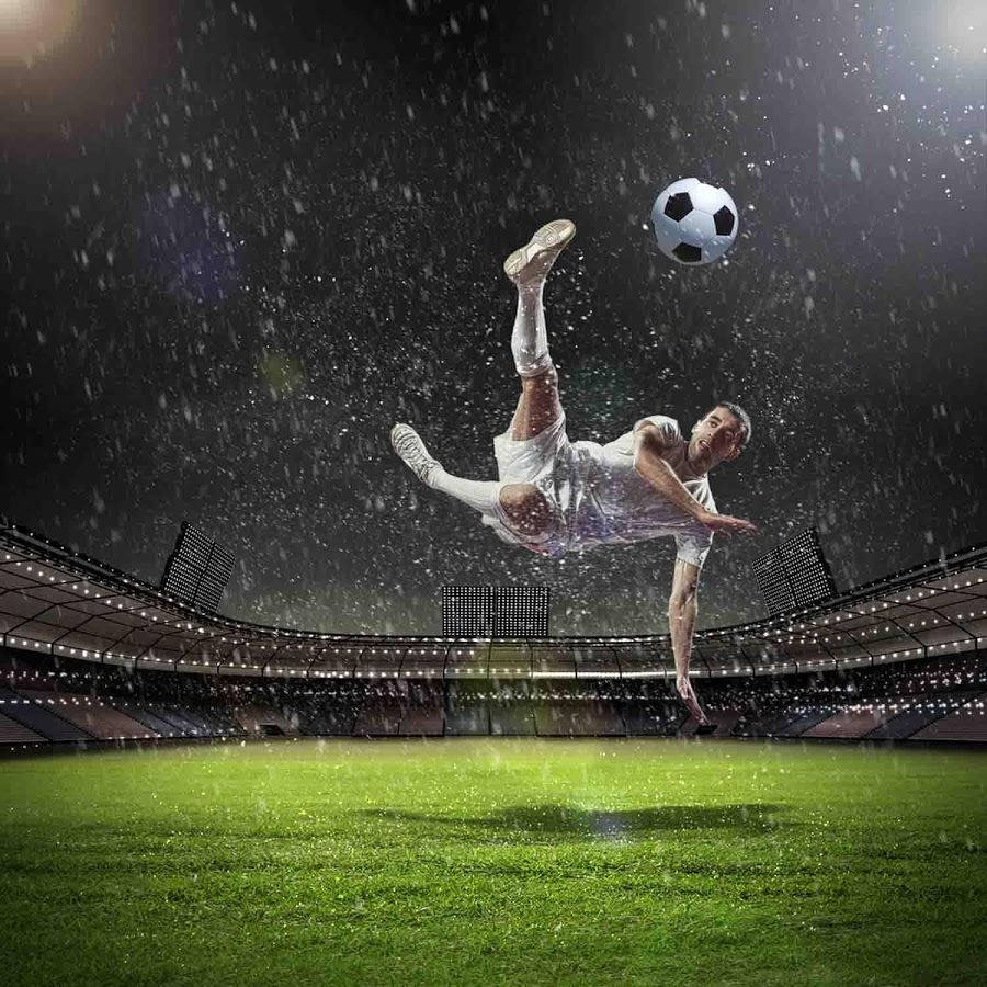 Player Kicking Soccer Ball Wallpaper
