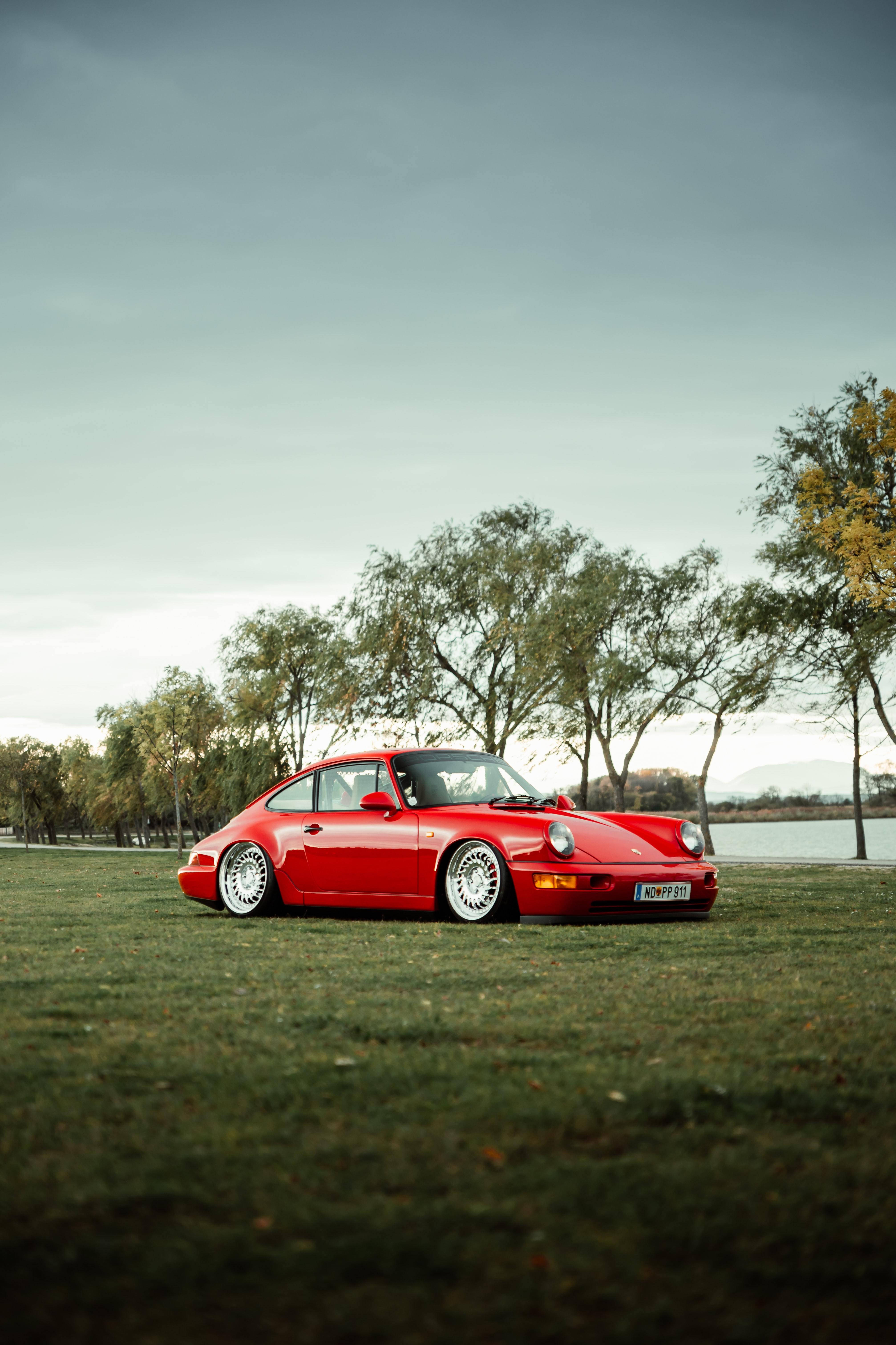 Porsche 911 Parked On The Field Wallpaper