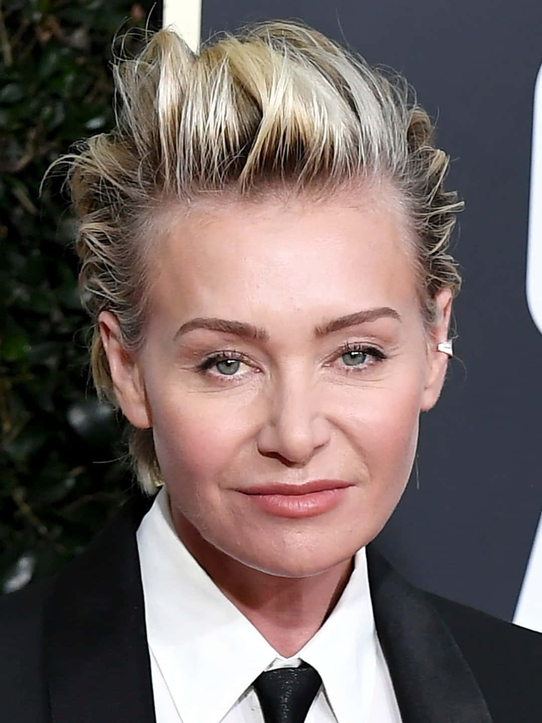 Portia De Rossi Elegant Black Suit Portrait Wallpaper