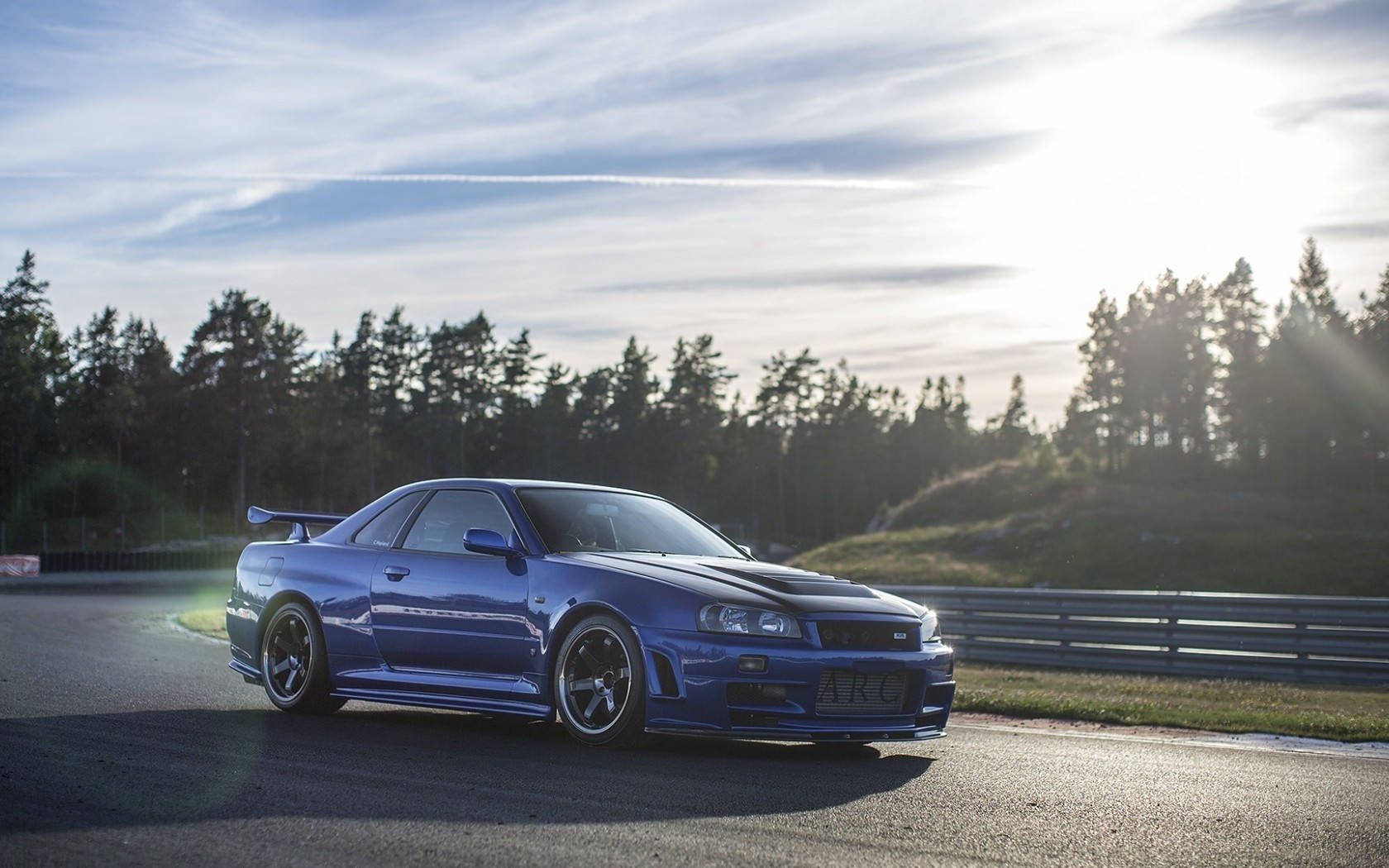 Powerful Aesthetic: Dark Blue Nissan Skyline Gtr R34 Wallpaper