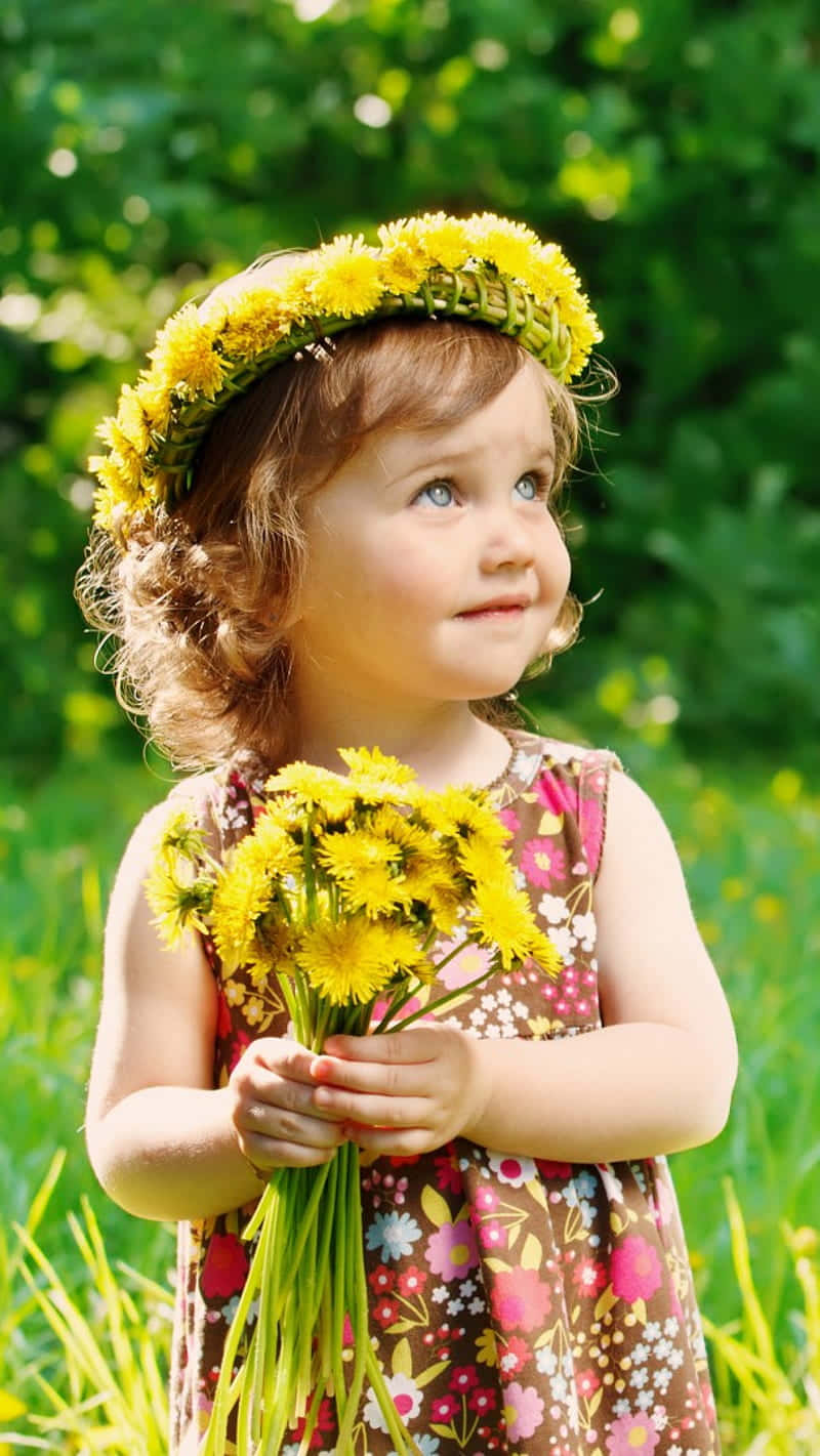 Pretty Baby Girl With Yellow Flower Crown Wallpaper