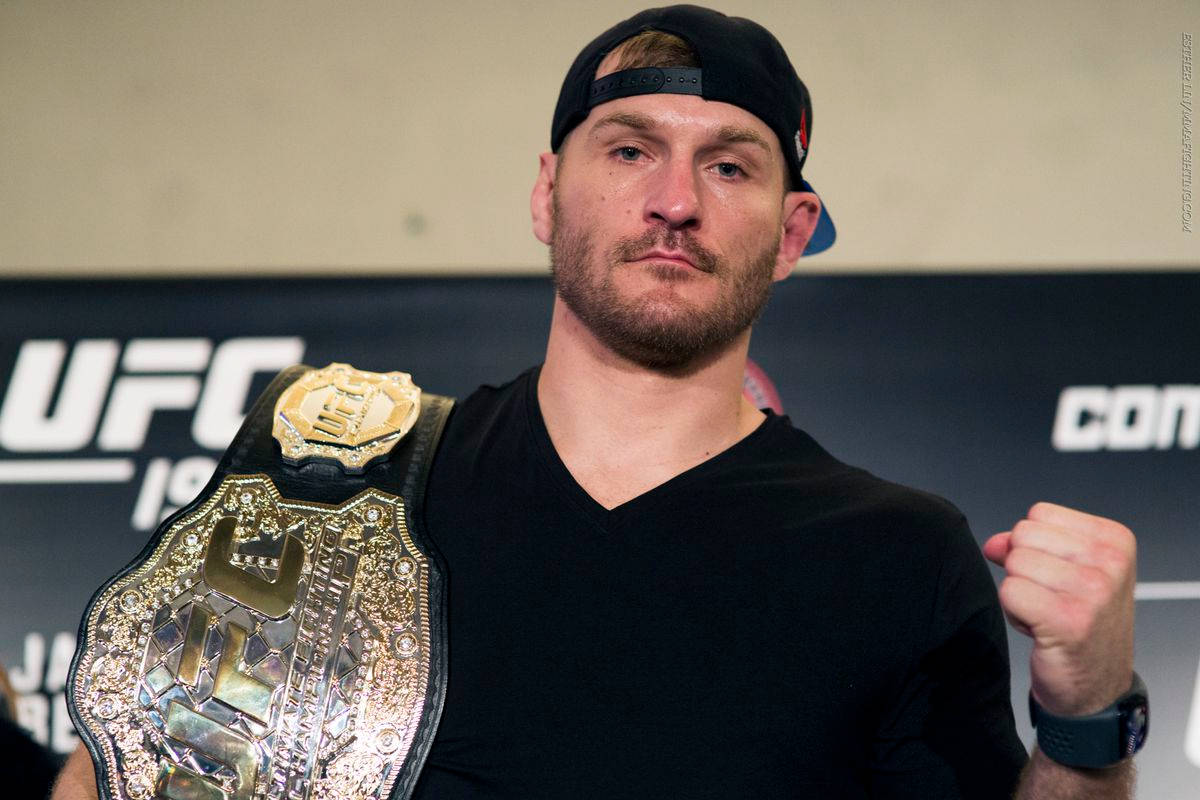 Pride Of The Octagon, Stipe Miocic Posing With Ufc Title Belt Wallpaper