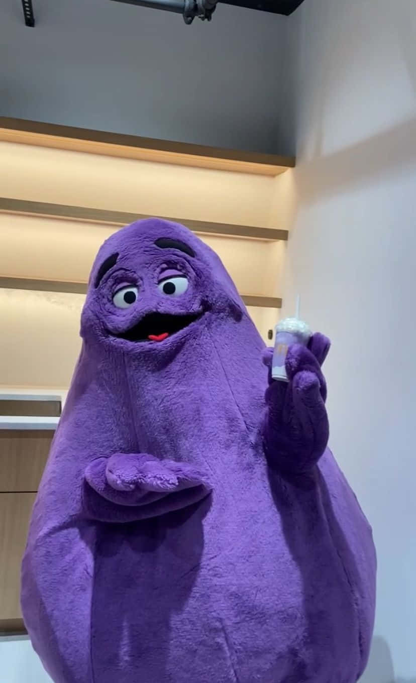 Purple_ Mascot_ With_ Drink.jpg Wallpaper