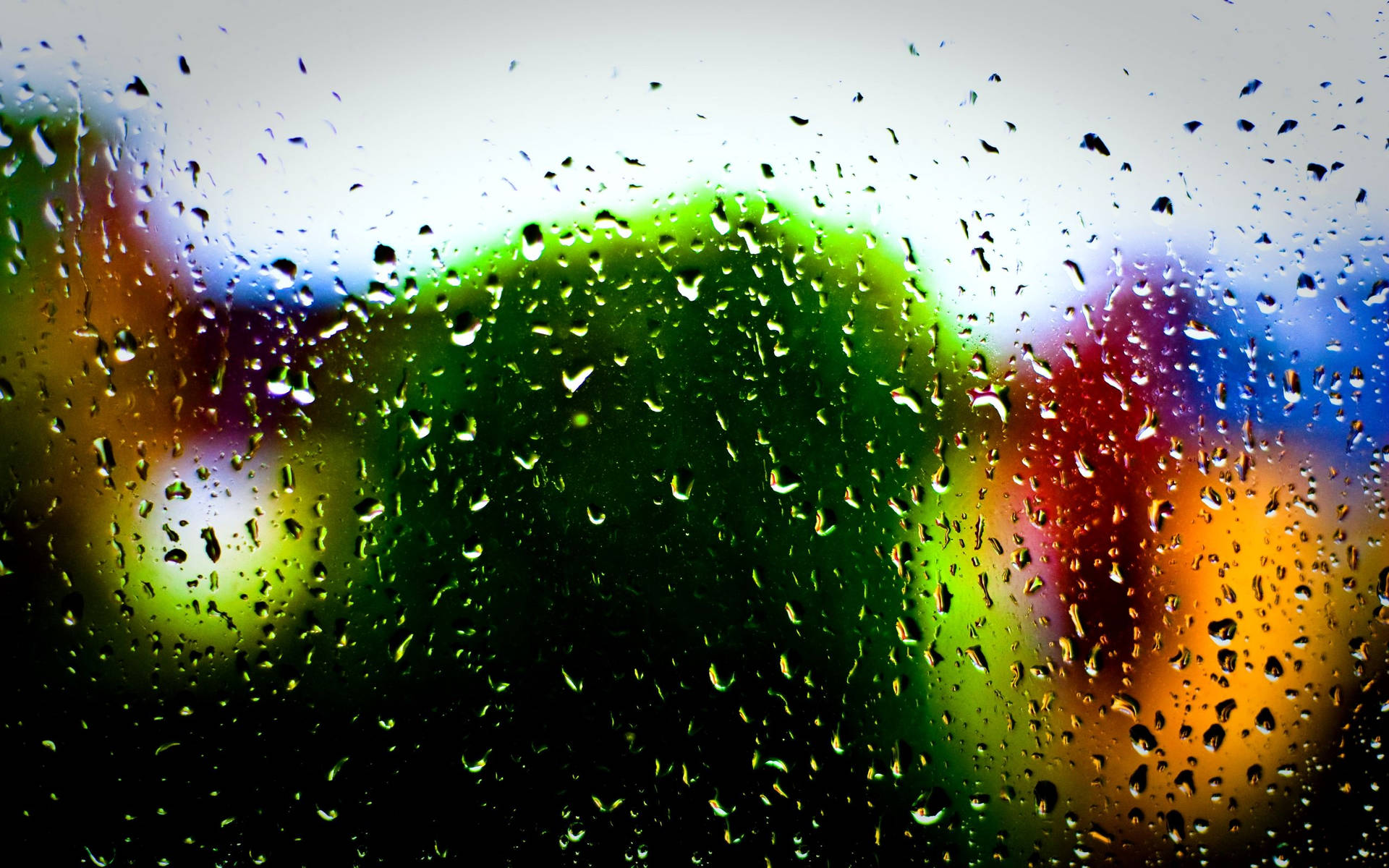 Raindrops On Glass Surface Multi Colored Bokeh Wallpaper