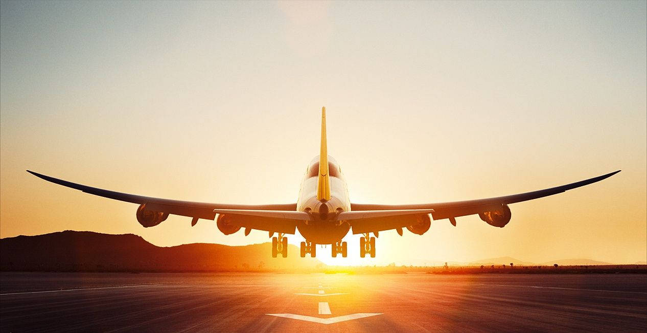 Ready For Take-off – An Airplane Begins Its Journey Wallpaper
