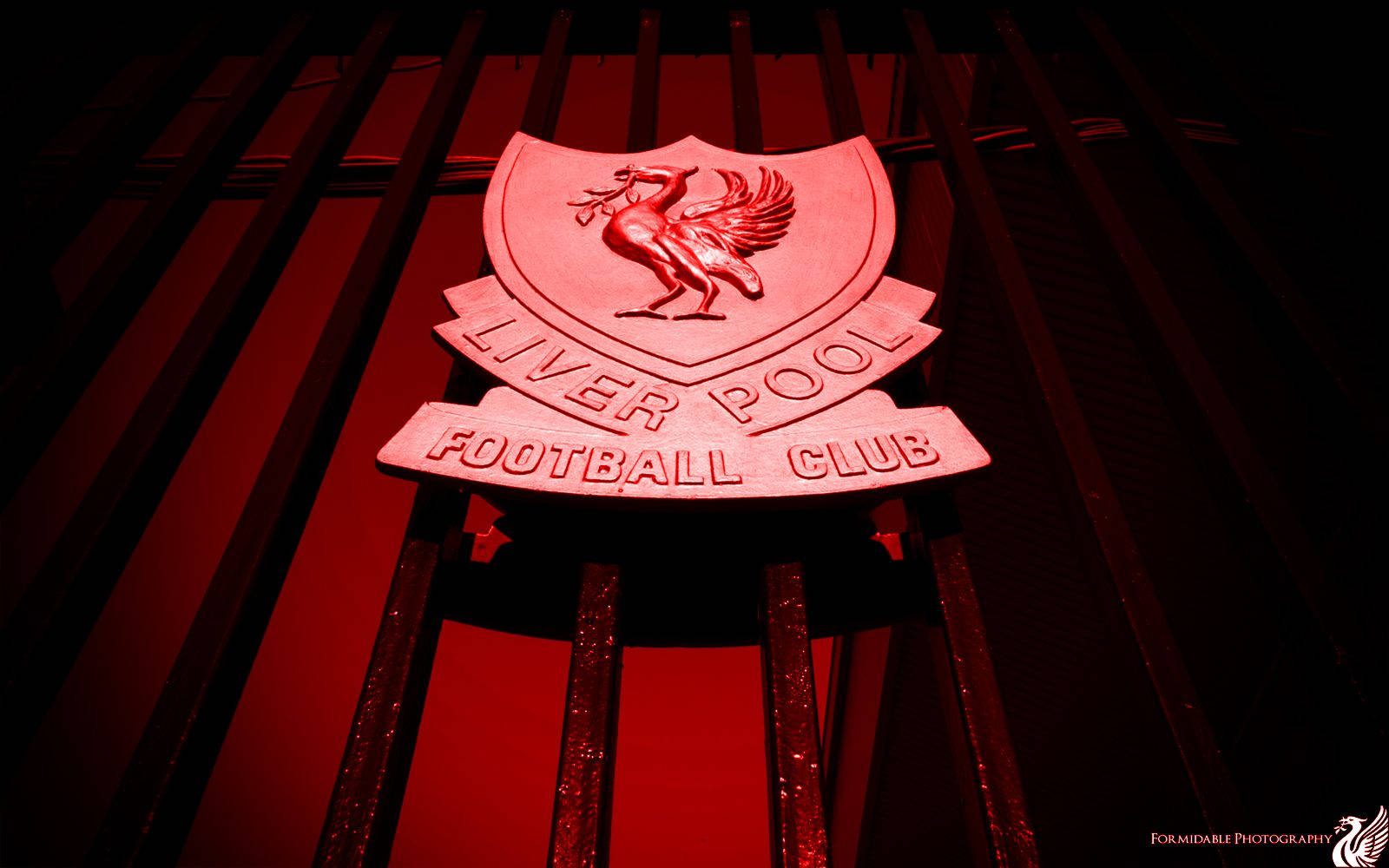 Red Liverpool Fc Logo On Shankly Gates Wallpaper