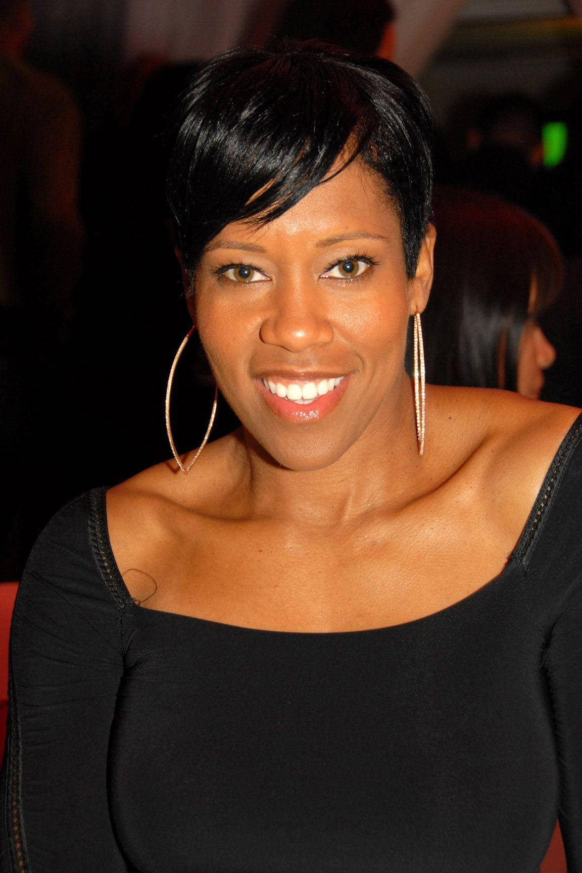 Regina King Smiling In Black Dress Portrait Wallpaper