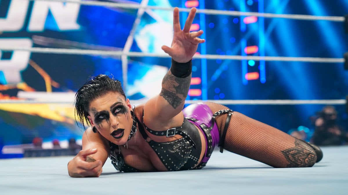 Rhea Ripley Wrestling Match Victory Gesture Wallpaper