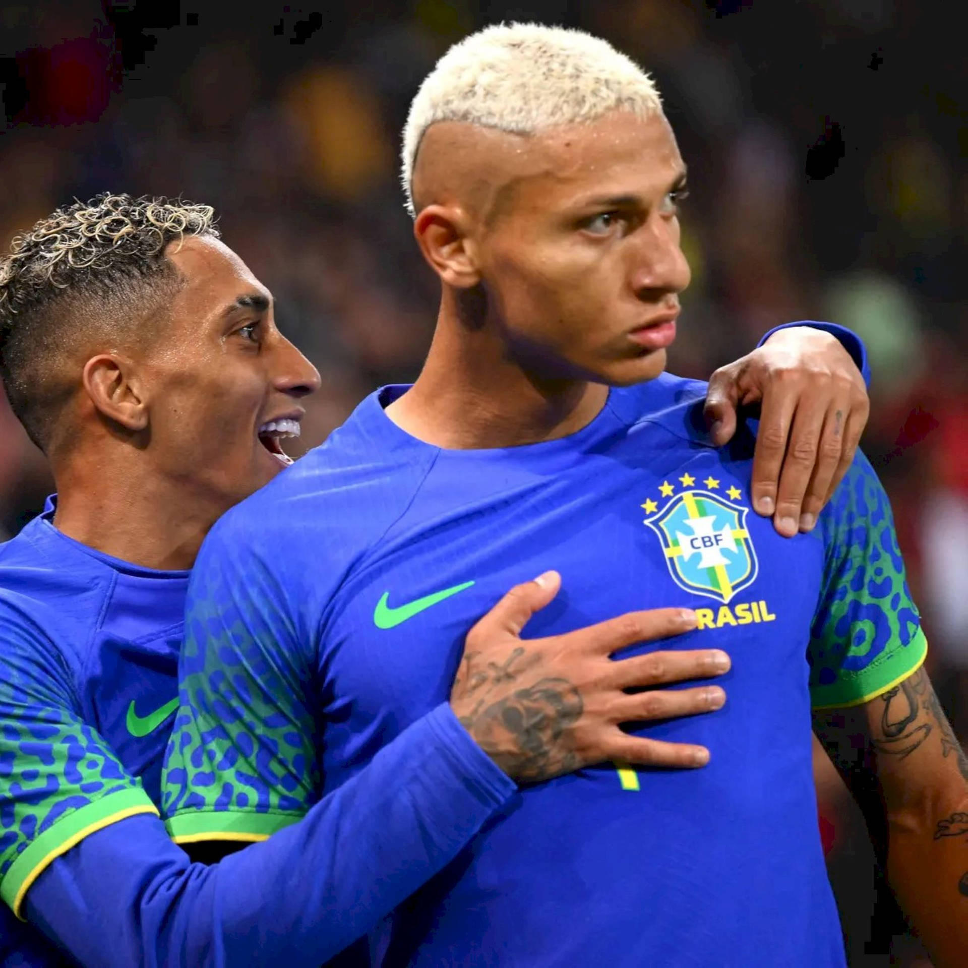 Richarlison De Andrade Hugged By Teammate Wallpaper