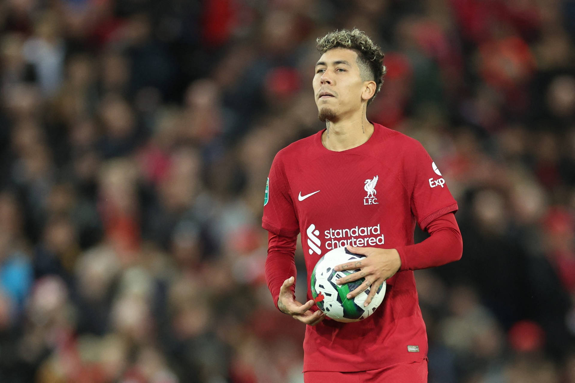 Roberto Firmino Holding Ball Near Stomach Wallpaper