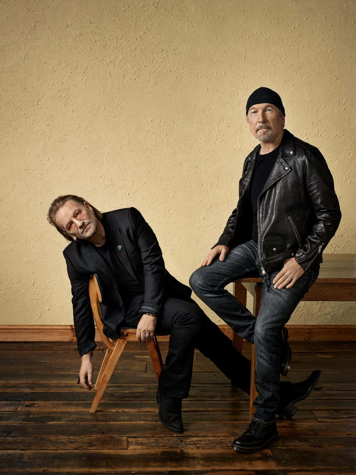 Rock Duo Leaning Against Wall Wallpaper