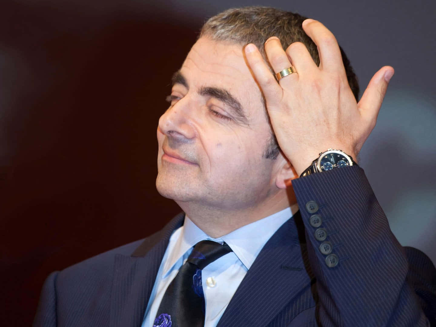 Rowan Atkinson Contemplative Gesture Wallpaper