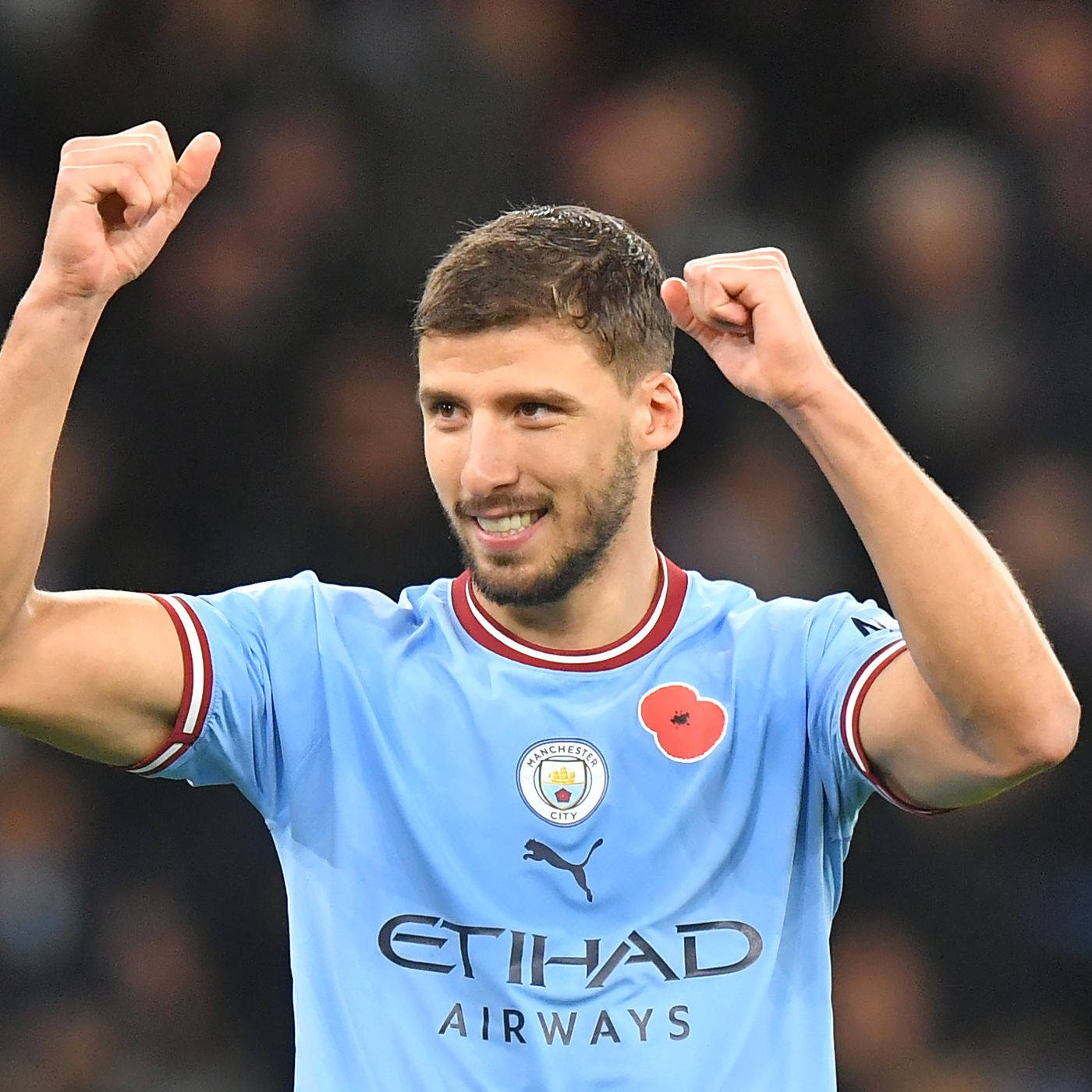 Ruben Dias Raising Both Of His Fists Wallpaper